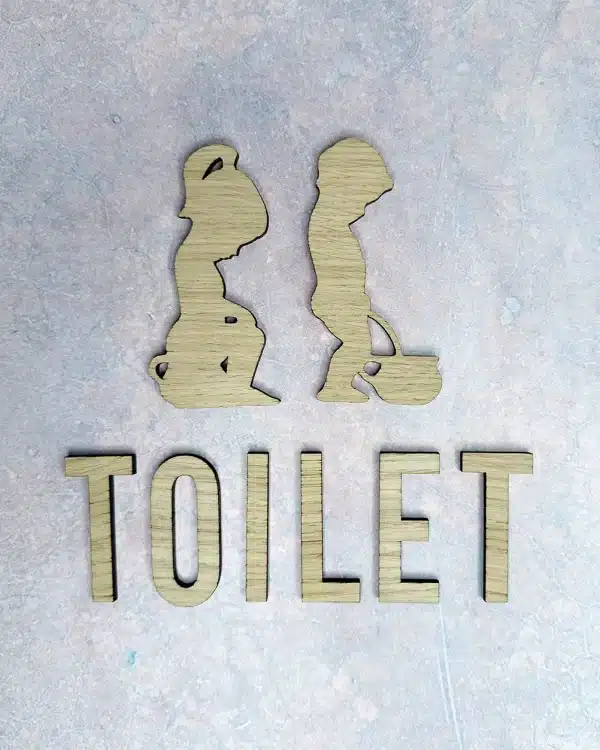 Tissende dreng og pige piktogram med TOILET sæt til toiletdøren